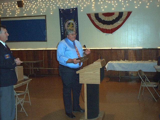 2006 Fall Conference - Estherville.    Jewell Chief Duane Hendrickson saying a few words on behalf of Ellen Hagen, one of the 2006 Roger Mooty Award recipients.  President Claassen also pictured.